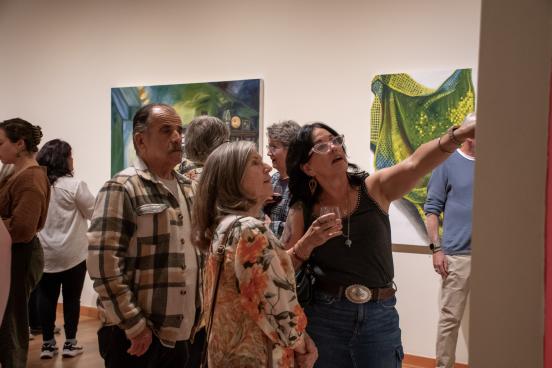 people looking at art