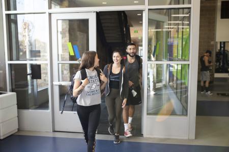 Group of students walk out of the rec center