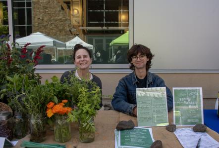 Two representatives of the garden club pose at their table