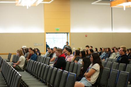 An audience watches intently